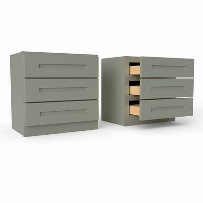 Two sage green drawers with wooden interior on a white background. three drawer countertop cabinet