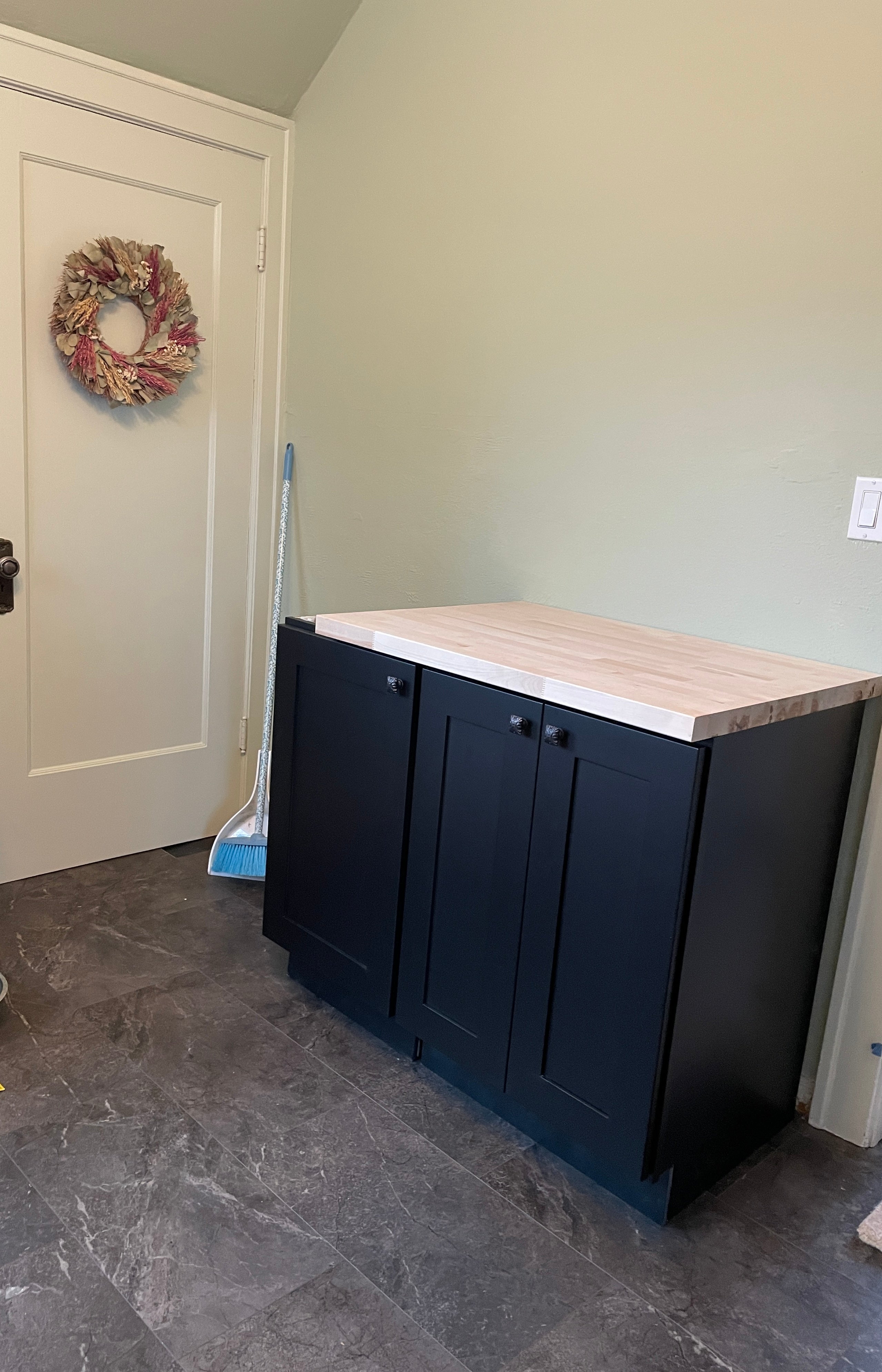 Shaker Black Cabinets Being Installed